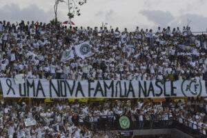 MEDELLIN, COLOMBIA - NOVEMBER 30:  Fans of Atletico Nacional hold a placard showing support to Chapecoense during a  tribute to brazilian soccer team Chapecoense following fatal airplane crash at Atanasio Girardot Stadium on November 30, 2016 in Medellin, Colombia. Players of Chapecoense were flying to Medellin to play the first leg Final match against Atletico Nacional as part of the Copa Sudamericana on November 30, 2016. (Photo by Marcos Ruiz/LatinContent/Getty Images)